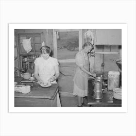 Mother And Daughter Working In The Kitchen Of The Cafe At Pie Town, New Mexico, The Daughter With Her Husban Art Print
