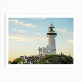 White Lighthouse At Dusk On Cliff With Beautiful Skies and Clouds Art Print