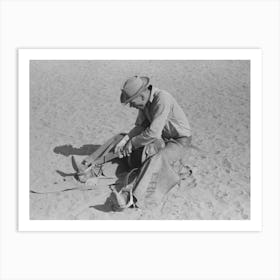 Cowboy Testing Stirrups At Rodeo Before Broncbusting, Quemado, New Mexico By Russell Lee Art Print