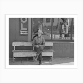 Man Sitting In Front Of Store, Craigville, Minnesota By Russell Lee Art Print