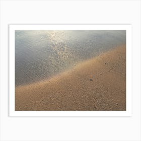 Beige sand and sea water at sunrise Art Print