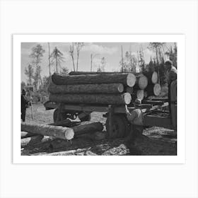 Unloading Timber From Truck At Camp, Near Effie, Minnesota By Russell Lee Art Print