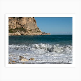 Foaming sea water and cliffs on the beach Art Print