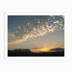 Clouds, sunlight and mountains at sunset Art Print