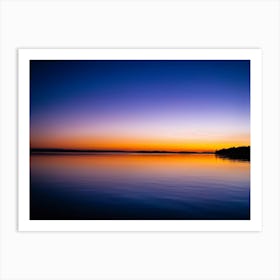 Tranquil Water Reflects Twilights Serene Glow Gentle Hues Of Orange And Purple Dancing On The Surf Art Print