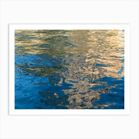 Golden reflections in the blue sea water Art Print