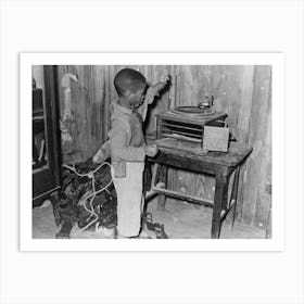 Child Playing Phonograph In Cabin Home, Transylvania Project, Louisiana By Russell Lee Art Print