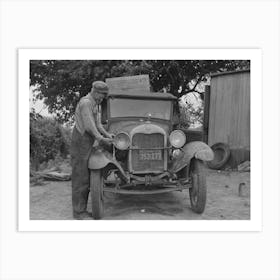 Untitled Photo, Possibly Related To Elmer Thomas, Migrant To California, Tying Sack Of Laundry Onto Front Lamp Art Print