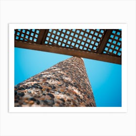 Low Angle View On Wooden Shade Of Seating Bench With Pebble Stone Column Art Print