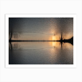 Reflection of golden sunlight in water at sunset Art Print