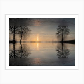 Reflection of trees in frozen water at sunset Art Print