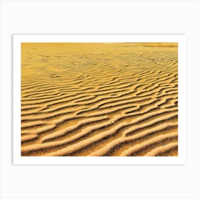 Sand Dune Texture. The image showcases a close-up view of a sandy surface, featuring a mesmerizing pattern of undulating waves and ridges. The sand is a warm, golden yellow, with darker lines and shadows accentuating the intricate texture. The light catches the peaks of the dunes, creating a subtle shimmer. The overall mood is serene and tranquil, evoking a sense of vastness and natural beauty. Art Print