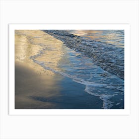 Reflections on the sandy beach at sunset Art Print