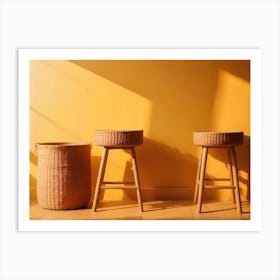 Two Wicker Baskets And A Wicker Stool Stand Against A Yellow Wall Art Print