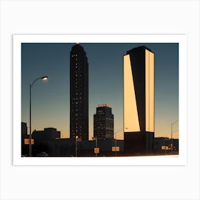 A Night Image Of City Buildings Illuminated With Lights Against A Dark Sky With Car Headlights Creating Streaks Of Light Art Print