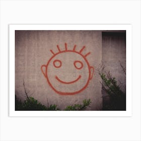 Graffiti Painting Of Red Happy Smiley Face On A Concrete Wall Art Print