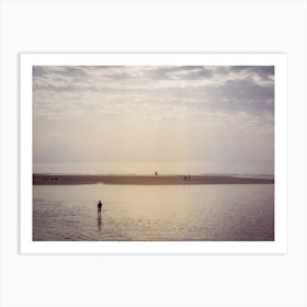 People Doing Various Activities Along The Shore Of The Beach At Sunset Art Print