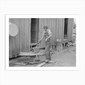 Son Of Sharecropper Pumping Water In Rear Of Cabin Home, New Madrid County, Missouri By Russell Lee Art Print