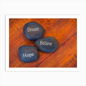 Black Inspirational Pebble Stones With The Words Dream, Believe And Hope On Wooden Background 1 Art Print