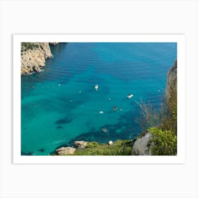 Turquoise sea water, cliffs and boats Art Print