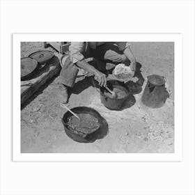 Cowboy Dishing Up Chili At Noonday Dinner, Cattle Ranch Near Marfa, Texas By Russell Lee Art Print