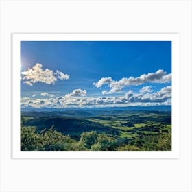 Cumulus Clouds Strewn Across A Blue Sky Above A Sweeping Scenic Landscape Vibrant Greenery Rollin (3) Art Print