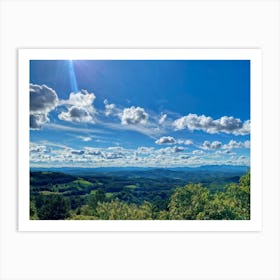 Cumulus Clouds Strewn Across A Blue Sky Above A Sweeping Scenic Landscape Vibrant Greenery Rollin (1) Art Print