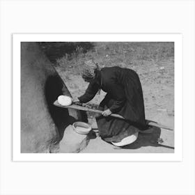 Spanish American Woman Putting Loaf Of Bread Into Oven, Taos County, New Mexico By Russell Lee Art Print