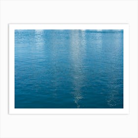 Reflections in blue sea water Art Print