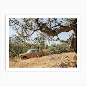 Yellow old car and olive trees Art Print