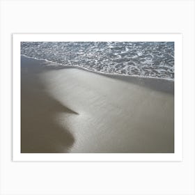 Sea water and reflections in wet sand Art Print