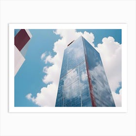 A Modern Skyscraper Made Of Glass Reflects The Blue Sky And Puffy White Clouds Above Art Print