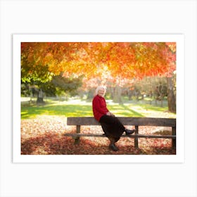 Woman Sits On A Bench In Autumn Art Print