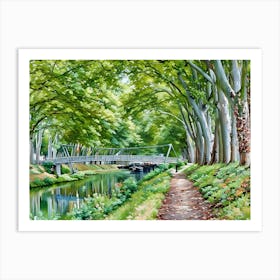 Tranquil Pathway near Canal de Brienne in Toulouse France. This image depicts a serene riverside scene with a narrow dirt path running alongside a calm river. The path is bordered by lush greenery and vibrant flowers, leading to a modern pedestrian bridge that spans the river. Tall trees with dense foliage arch over the path and river, creating a canopy of green. The reflection of the trees and bridge in the water adds to the tranquil atmosphere. Art Print