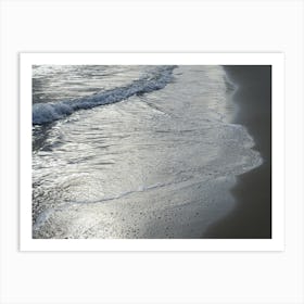 Sea water and silver reflections in wet sand Art Print