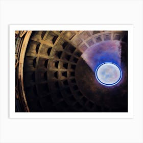 Oculus of the Pantheon. This image captures the interior view of the Pantheon’s dome, focusing on the oculus at its apex. The coffered ceiling, with its geometric patterns, is illuminated by natural light streaming through the oculus, creating a dramatic interplay of light and shadow. The oculus, a circular opening at the top of the dome, serves as the primary source of light for the Pantheon’s interior and symbolizes the connection between the temple and the heavens. Art Print