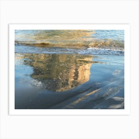 Reflection of a rock on the sandy beach Art Print