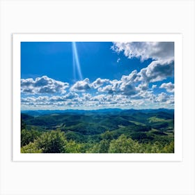 Cumulus Clouds Strewn Across A Blue Sky Above A Sweeping Scenic Landscape Vibrant Greenery Rollin (2) Art Print