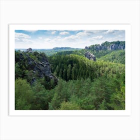 Sandstone rocks and green forest near the Bastei in Saxon Switzerland Art Print