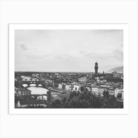 Panoramic View of Florence. This image depicts a panoramic view of Florence, Italy, showcasing its iconic architectural landmarks. The prominent structures include the Florence Cathedral with its distinctive dome and the Palazzo Vecchio with its tall tower. The cityscape is set against a backdrop of rolling hills and a partly cloudy sky, capturing the historical and cultural essence of Florence. Art Print