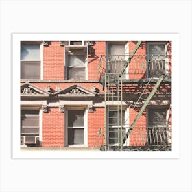 New York, USA I Little Italy building in red brick with fire escape and window for minimalist and geometric architecture photography for a Christmas and holidays atmosphere in winter interior decoration Art Print