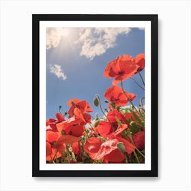 Red poppies field with blue cloudy sky at horizon Art Print