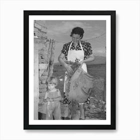 Spanish American Woman And Her Son With Greens Which They Feed To Their Rabbits Near Taos, New Mexico By Art Print