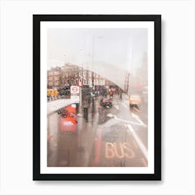 London, England I View of a rainy street through the fogged window of a legendary red London bus capturing nostalgic atmosphere photography and vibrant colors of the city in the rain with grey moody aesthetic Art Print