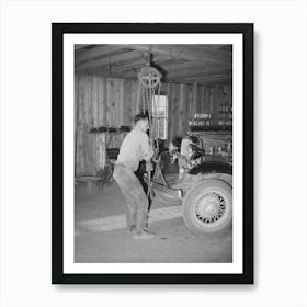 Garage Owner Hoisting Car So That He Can Make Repairs, Pie Town, New Mexico By Russell Lee Art Print