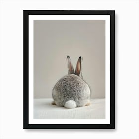 Grey Rabbit Sitting On A Table Art Print