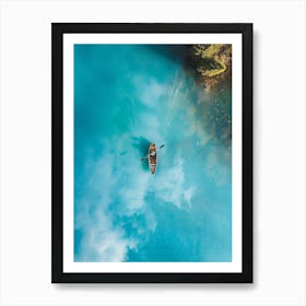 Canoe In Blue Water Art Print