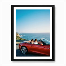 Couple Basks In Golden Hour Glow As They Drive A Vibrant Red Convertible Down A Coastal Highway Cli (4) Art Print