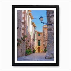 Romantic street in the old village of Valldemossa on Mallorca, Spain Balearic islands. Lose yourself in the idyllic old village of Valldemossa on Mallorca, Spain Balearic islands. This romantic street is a famous landmark that depicts the rich history and Mediterranean culture of the town. Art Print