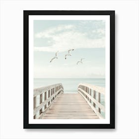 Seagulls Flying Over A Pier Art Print